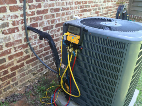 An AC system in Canton, OH getting a maintenance check.
